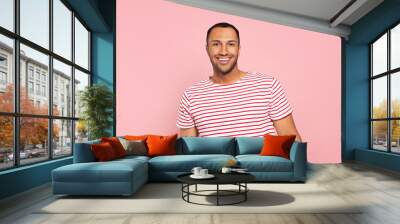 Portrait of happy African American man on pink background Wall mural