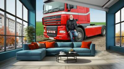 Portrait of mature driver at modern truck outdoors Wall mural