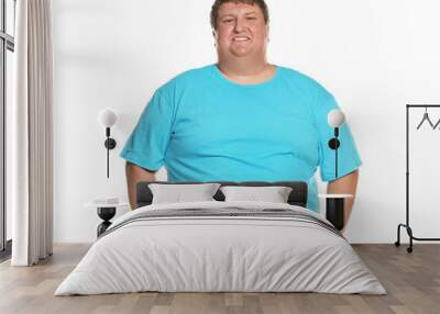 Portrait of overweight man posing on white background Wall mural