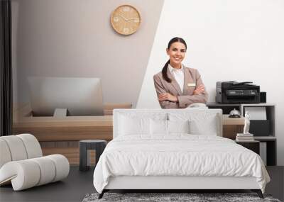 Portrait of receptionist at desk in modern hotel Wall mural