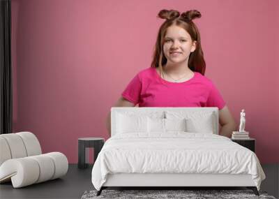 Portrait of teenage girl on pink background, space for text Wall mural