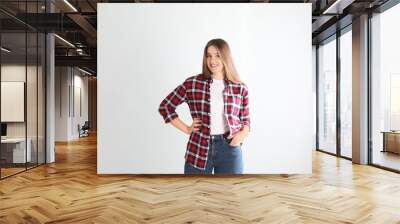 Portrait of young woman on white background Wall mural