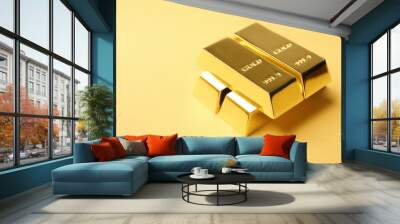 Precious shiny gold bars on color background. Space for text Wall mural