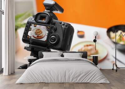 Professional camera with picture of meat medallion on display in photo studio, space for text. Food stylist Wall mural