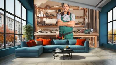 Professional carpenter with set of tools in workshop Wall mural