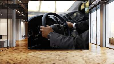 Professional driver in luxury car, closeup. Chauffeur service Wall mural