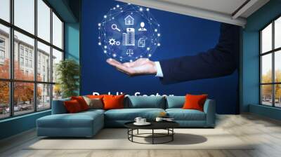 Public Sector concept. Man presenting different virtual icons on blue background, closeup Wall mural