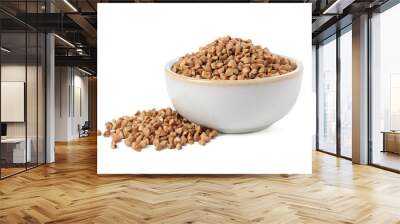 Raw buckwheat in bowl isolated on white Wall mural