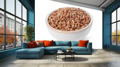 Raw buckwheat in bowl isolated on white Wall mural