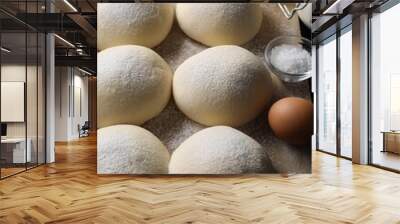 Raw dough balls, yolk, salt, flour, eggs and rolling pin on table Wall mural