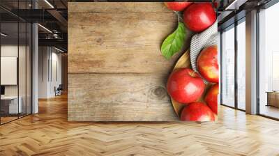 Ripe juicy red apples on wooden background, flat lay. Space for text Wall mural