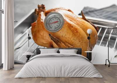 Roasted turkey with meat thermometer on baking rack Wall mural