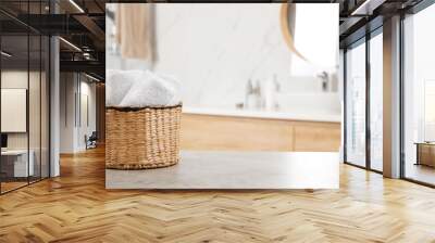 Rolled fresh towels on grey table in bathroom. Space for text Wall mural