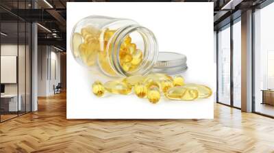 Scattered softgel capsules and bottle isolated on white Wall mural