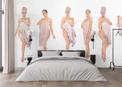 Set of beautiful young woman with towels on white background Wall mural