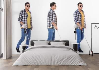 Set of blind man with long cane walking on white background Wall mural