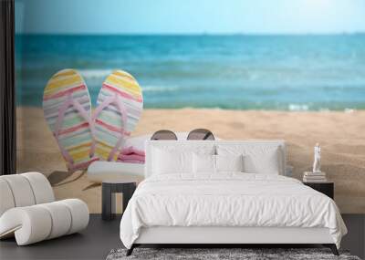 Set of different beach objects on sand near sea. Space for text Wall mural