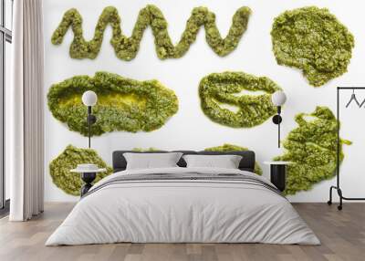 Set of fresh pesto sauce isolated on white, top view Wall mural