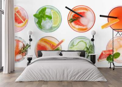 Set of glasses with different refreshing drinks on white background, top view Wall mural