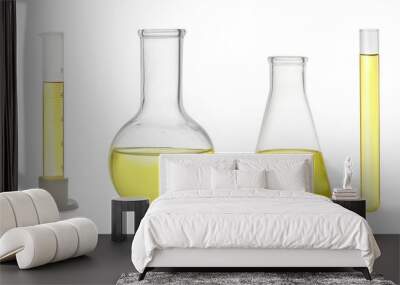 Set of laboratory glassware with yellow liquid on white background. Banner design Wall mural