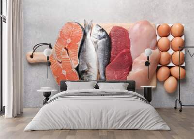 Set of natural food high in protein on grey background, top view Wall mural