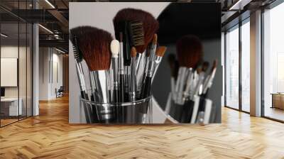 Set of professional brushes and mirror on grey background, closeup Wall mural