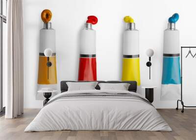 Set of tubes with colorful oil paints on white background, top view Wall mural