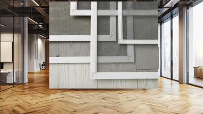 Set of window screens on wooden floor, closeup Wall mural