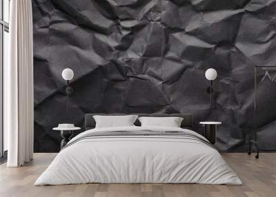 Sheet of black crumpled paper as background. Space for design Wall mural