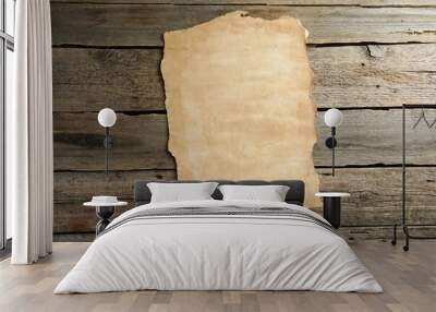 Sheet of old parchment paper on wooden table, top view Wall mural