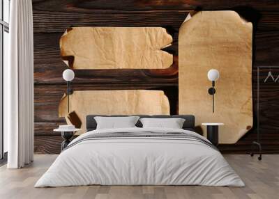 Sheets of old parchment paper on wooden table, flat lay Wall mural