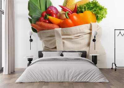 Shopping bag with fresh vegetables on white background Wall mural