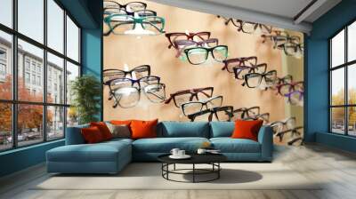 Showcase with different glasses in optical store. Ophthalmologist prescription Wall mural