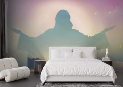 Silhouette of Jesus Christ and cloudy sky, double exposure Wall mural