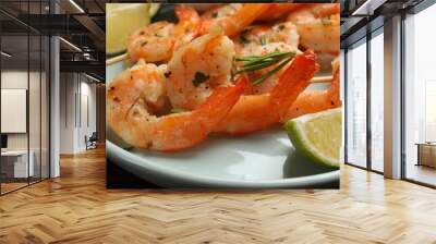 Skewers with delicious grilled shrimps served on plate, closeup Wall mural