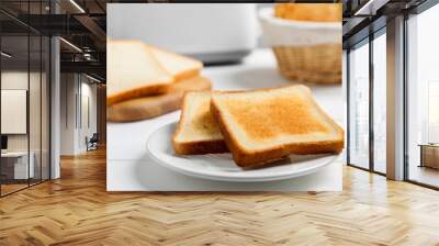 Slices of tasty toasted bread on white wooden table, closeup Wall mural