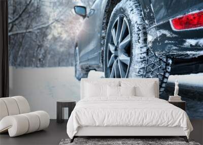 Snowy country road with car on winter day, closeup. Space for text Wall mural