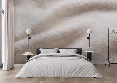 Soft beige knitted fabric as background, closeup Wall mural