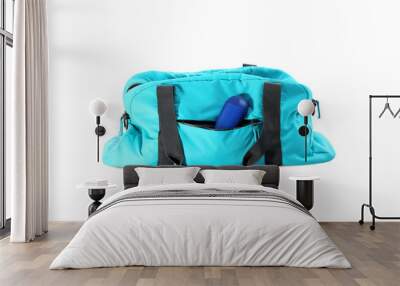 Sport bag with deodorant on white background Wall mural