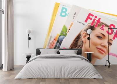 Stack of different magazines on white background, closeup Wall mural