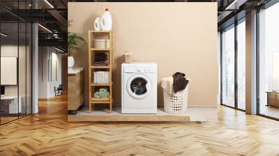 Stylish laundry room interior with washing machine, furniture and houseplant Wall mural