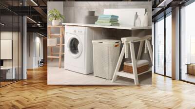 Stylish laundry room with modern washing machine. Interior design Wall mural