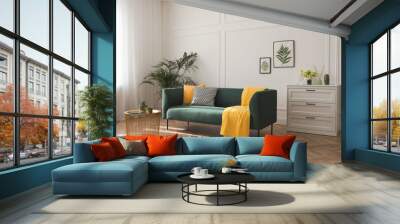 Stylish living room interior with comfortable green sofa Wall mural