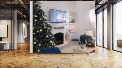 Stylish living room interior with modern TV, fireplace and Christmas tree Wall mural