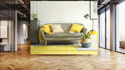 Stylish living room with sofa. Interior design in grey and yellow colors Wall mural