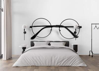 Stylish pair of glasses with black frame on white background, top view Wall mural