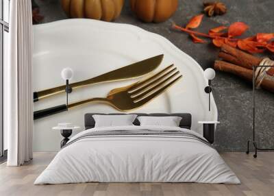 Stylish place setting and autumn decor on grey textured table, closeup Wall mural