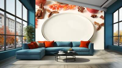 Stylish plate and autumn decor on white background Wall mural