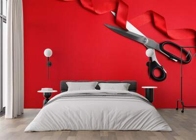 Stylish scissors and red ribbon on color background, flat lay with space for text. Ceremonial tape cutting Wall mural