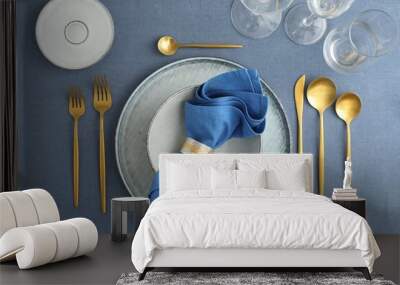 Stylish setting with cutlery, plates, napkin and glasses on table, flat lay Wall mural